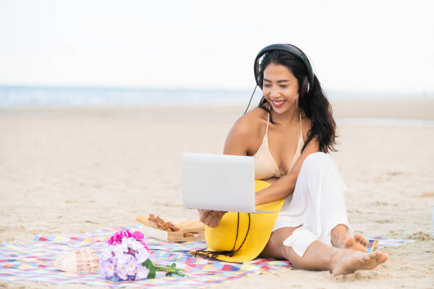 istock Plus size young woman sitting on the beach. 982444208
