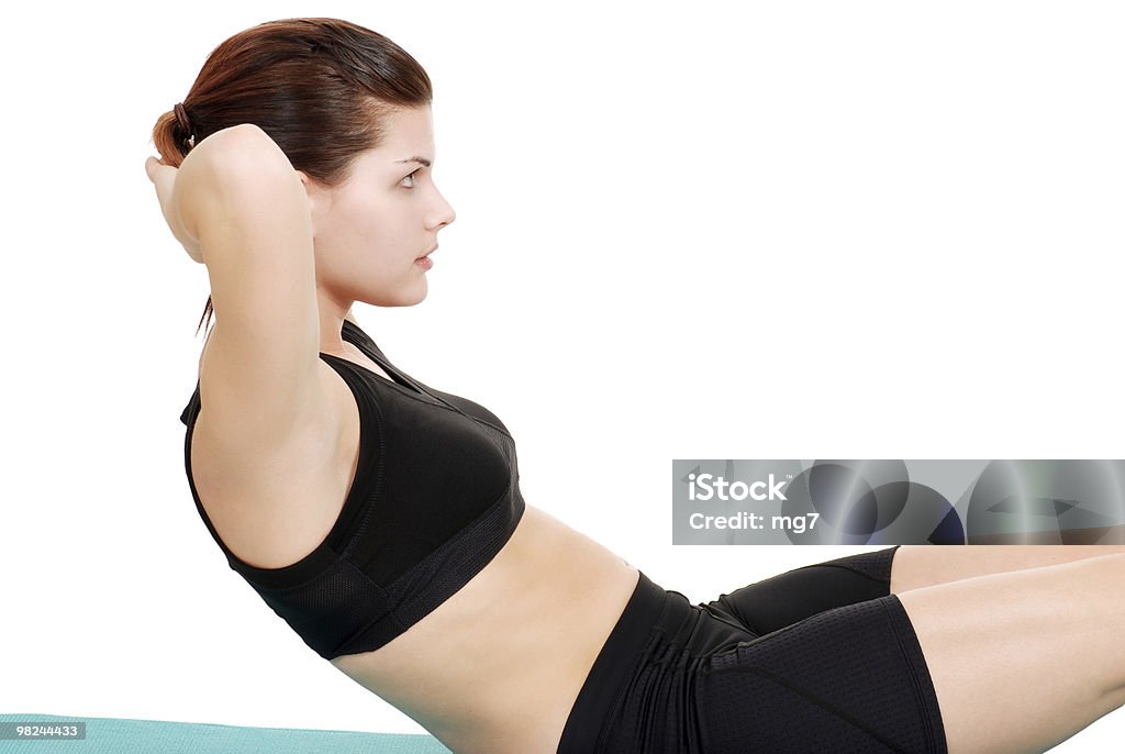 brunette woman doing a sit up  Abdominal Muscle Stock Photo