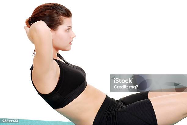 Brunette Woman Doing A Sit Up Stock Photo - Download Image Now - Abdominal Muscle, Active Lifestyle, Adult