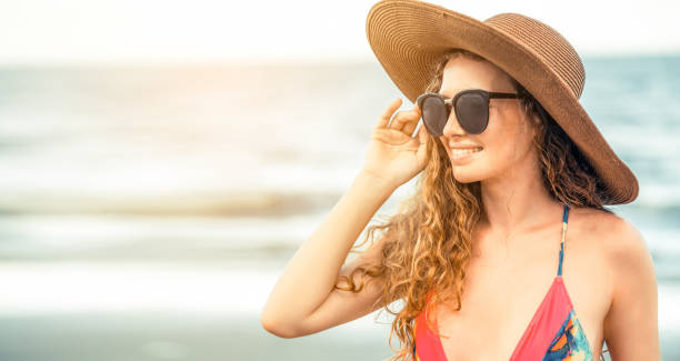 istock Happy young woman at beach in summer vacation. 982448680