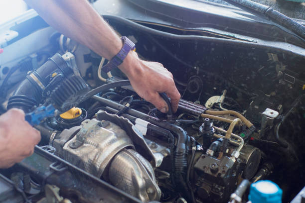 istock Auto mechanic repairing car. Selective focus. 982449176