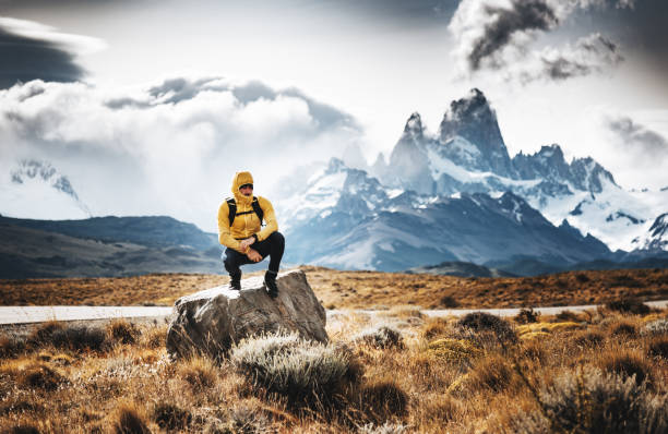 istock man resting on the rock in el chalten 982450560