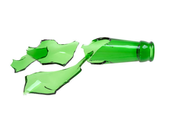 istock broken bottle of green, broken glass on white background 982464934