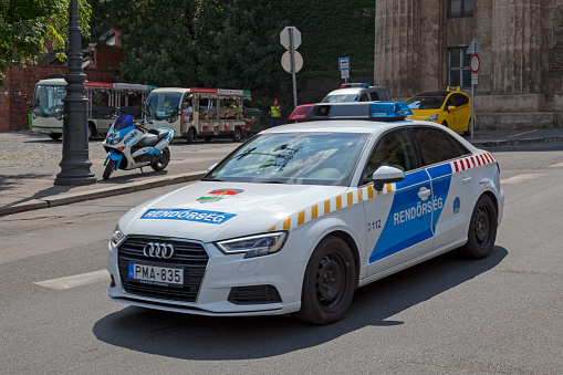 Budapest, Hungary - June 21 2018: Policemen (Rendorseg) driving around Castle Hill in their police car.