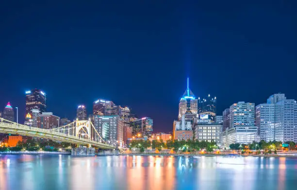 Photo of pittsburgh,pennsylvania,usa : 8-21-17. pittsburgh skyline at night with reflection in the water.