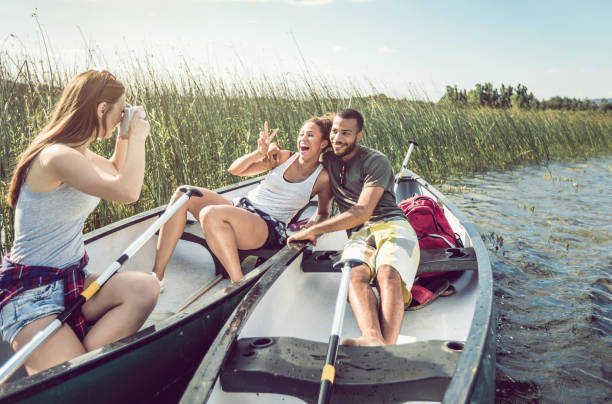 istock Young Woman Canoeing on the Lake 982488178
