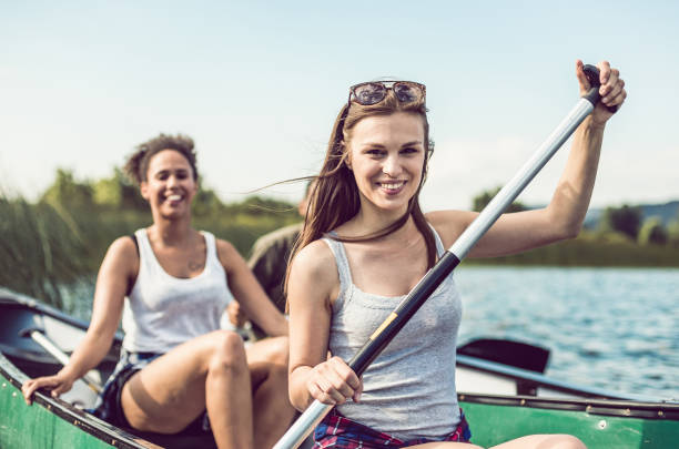 istock Small Group of Friends Canoeing on the Lake 982494770