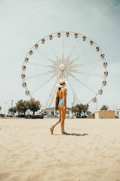 istock Young woman at italian beach 982497988