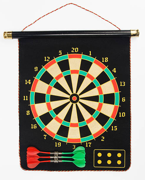 Darts set on a black sheet board stock photo
