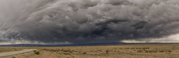istock Utah road and incoming storm, panorama 982512928