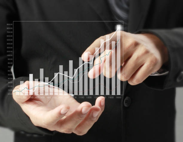 istock businessman with financial symbols coming 982520116