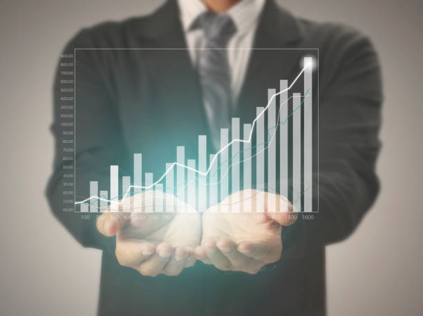 istock businessman with financial symbols coming 982520138