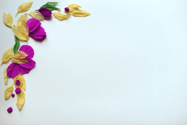 istock Floral frame of tissue paper on blue background 982524832