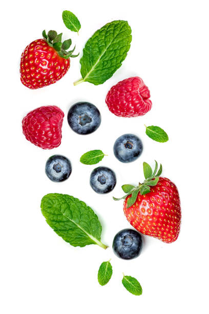 istock Fresh berries isolated on white background, Macro. Strawberry, Raspberry, Blueberries  and Mint leaf, flat lay 982533038