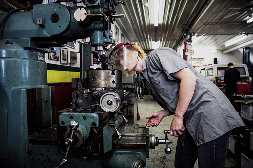 Female, Garage, Blue Collar, Employment, Expert, Dedication - Image of a young female mechanic at her workshop