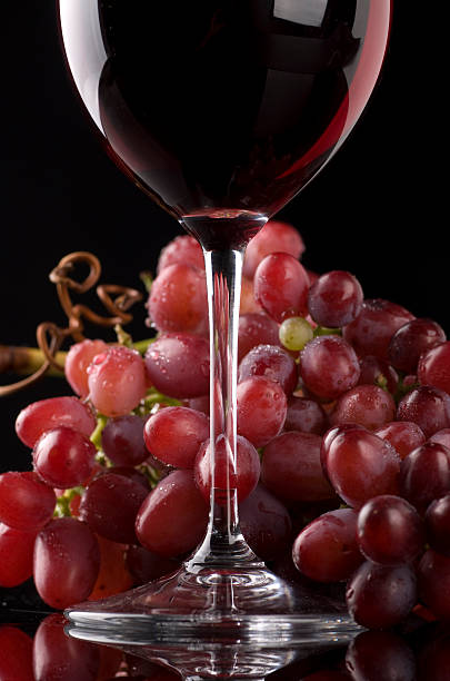 istock Glass of Red Wine with Grapes 98254470