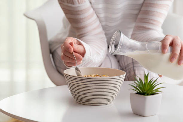 istock Woman having cereal for breakfast 982556202