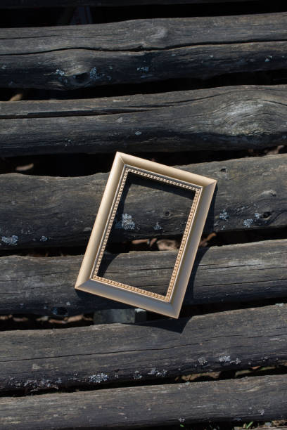 istock Blank wooden picture  frame on  background 982574702