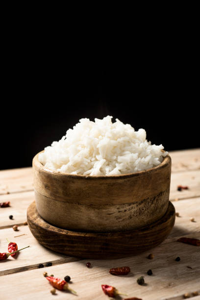 istock cooked long grain rice in a boxwood bowl 982580458