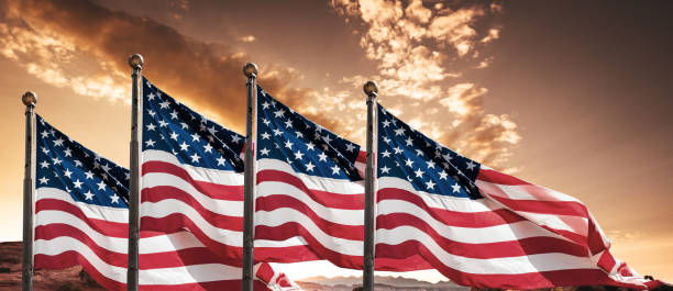 istock us flags at dusk for the us national day 982580712