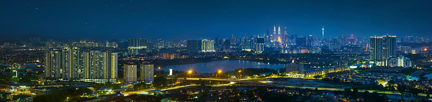 Panorama 
view in the middle of Kuala Lumpur cityscape skyline .Night scene , Malaysia .