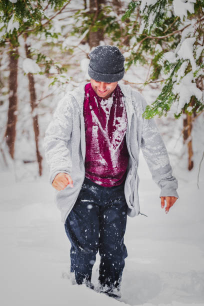 istock Young man exploring Vermont woodland during extreme winter 982590110