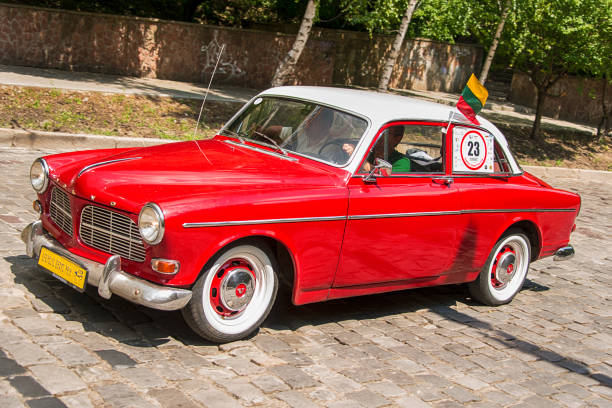 Lviv, Ukraine - June 3, 2018:Old retro car Volvo Amazon 13134  its owner and an unknown passenger taking participation in race Leopolis grand prix 2018, Ukraine.