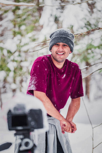 istock Young man exploring Vermont woodland during extreme winter 982596008