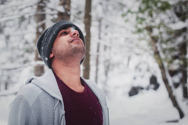 istock Young man exploring Vermont woodland during extreme winter 982597190
