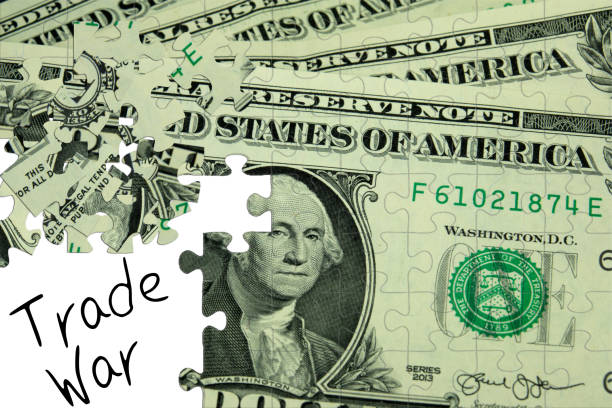 istock A puzzle, dollar bill and trade war between USA and Europe 982601410
