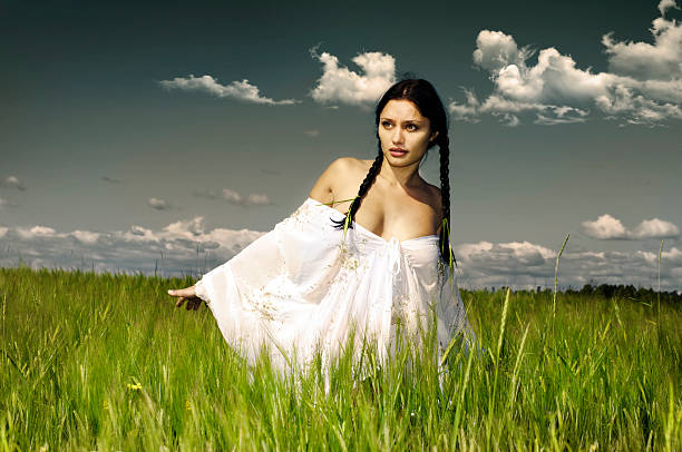 woman take a breath in front on the sunset