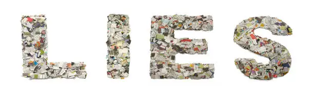 the word   LIES  made from newspaper confetti  isolated