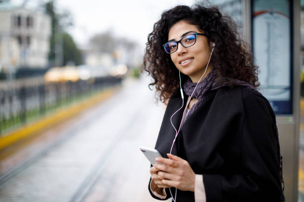 istock Woman waiting for train at the station 982635106