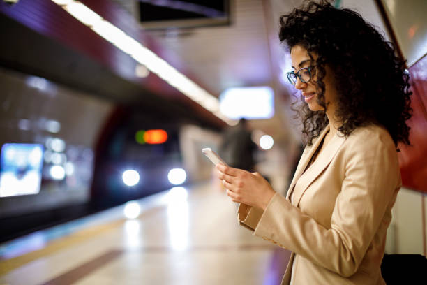 istock Businesswoman using mobile phone on the subway station 982638778