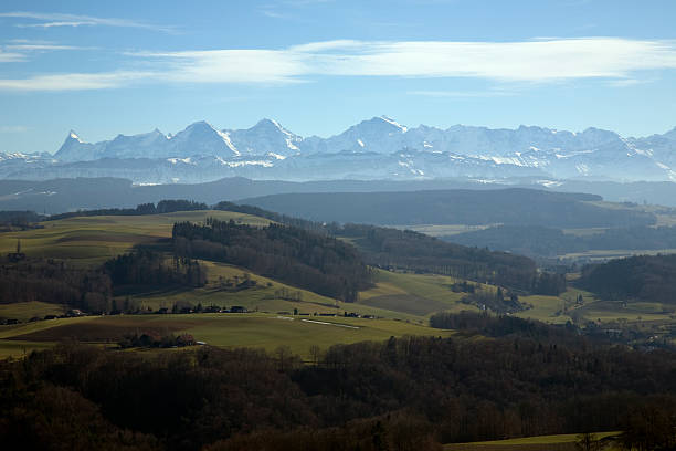 Bernese Alps Panorama with farmland in the foreground.  jungfrau stock pictures, royalty-free photos & images