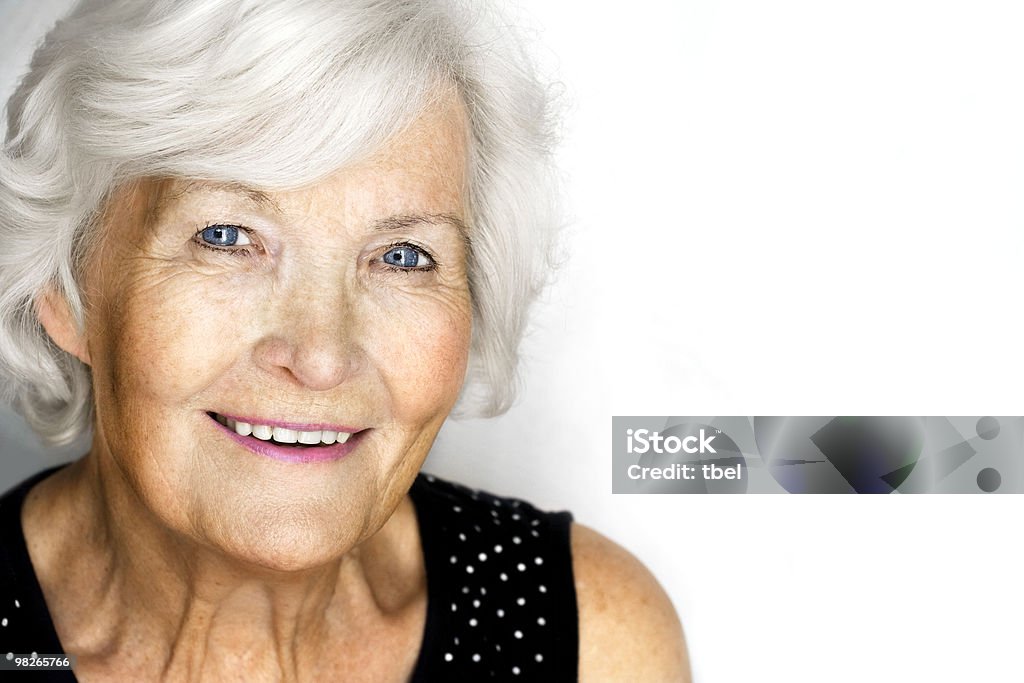 Senior woman portrait Senior woman portrait, attractive smiling to camera, white background with much copy space 70-79 Years Stock Photo