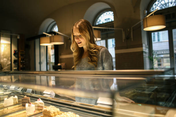 istock Girl choosing a dessert 982658750