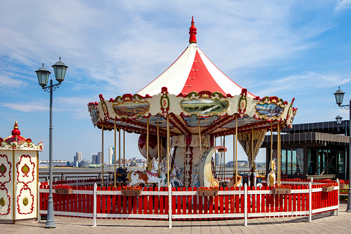 Vintage carousel with horses. A horse on a children's vintage carousel.