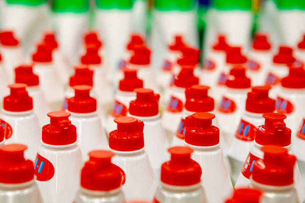 istock Straight rows of bright red corks on bottles. 982664092