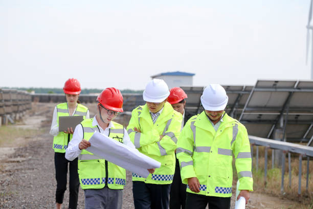 Asian electrical engineer team visits China photovoltaic energy base