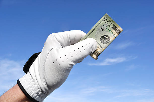 Golfer Holding a Twenty Dollar Bill golf betting stock pictures, royalty-free photos & images
