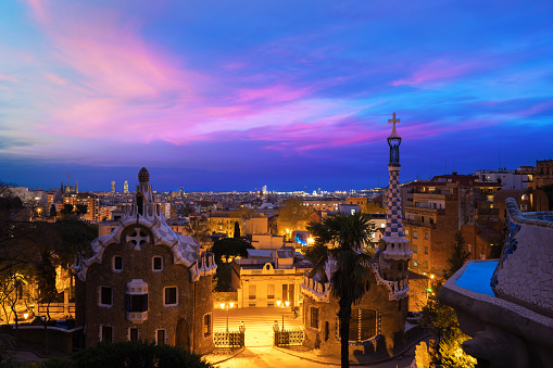 Park Guell in Barcelona, Spain at night. Barcelona skyline.