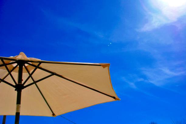 sun umbrella against the blue sky