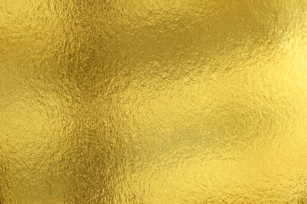 istock Shiny yellow leaf gold foil texture background 982729682