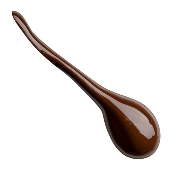 istock Melting chocolate drips. Chocolate isolated on white background. 982735524