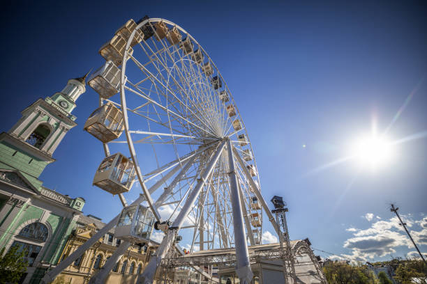 istock Big ferris wheel against the blue sky. 982735564