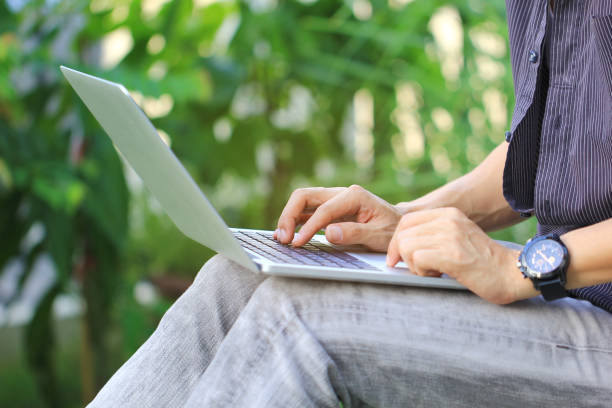 istock Business man of freelancer working using laptop computer in home office, Communication technology and Business concept 982741530