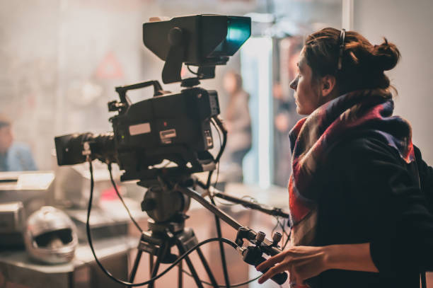 Behind the scene. Actor in front of the camera Behind the scene. Actor in front of the camera on the film set in film studio. Group movie scene camera operator photos stock pictures, royalty-free photos & images