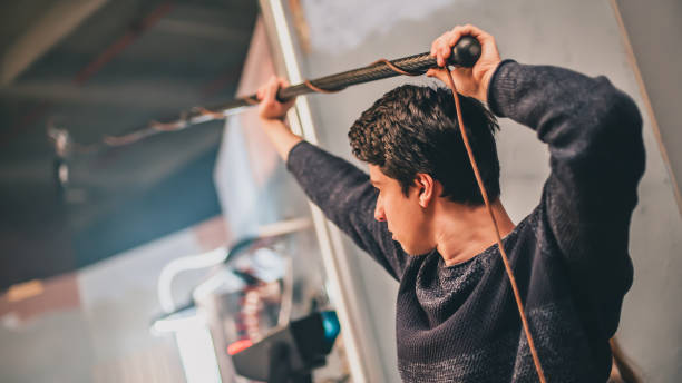 Behind the scene. Sound boom operator hold microphone fisher