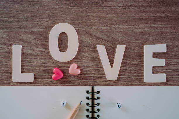 istock Valentines Day background with love text decoration and greeting design concept 982754382